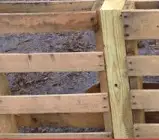 6 reasons that I think a pallet fence makes the best fence for small livestock! Pictures and instructions included on how the pallet fence was built.