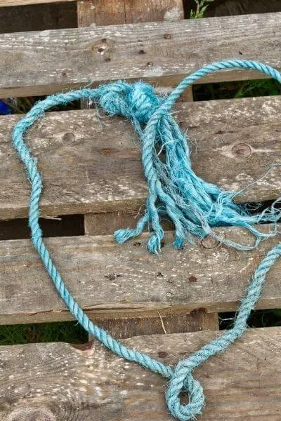 Pallet with a blue string made into a heart