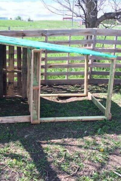 Pallet goat house with porch attached